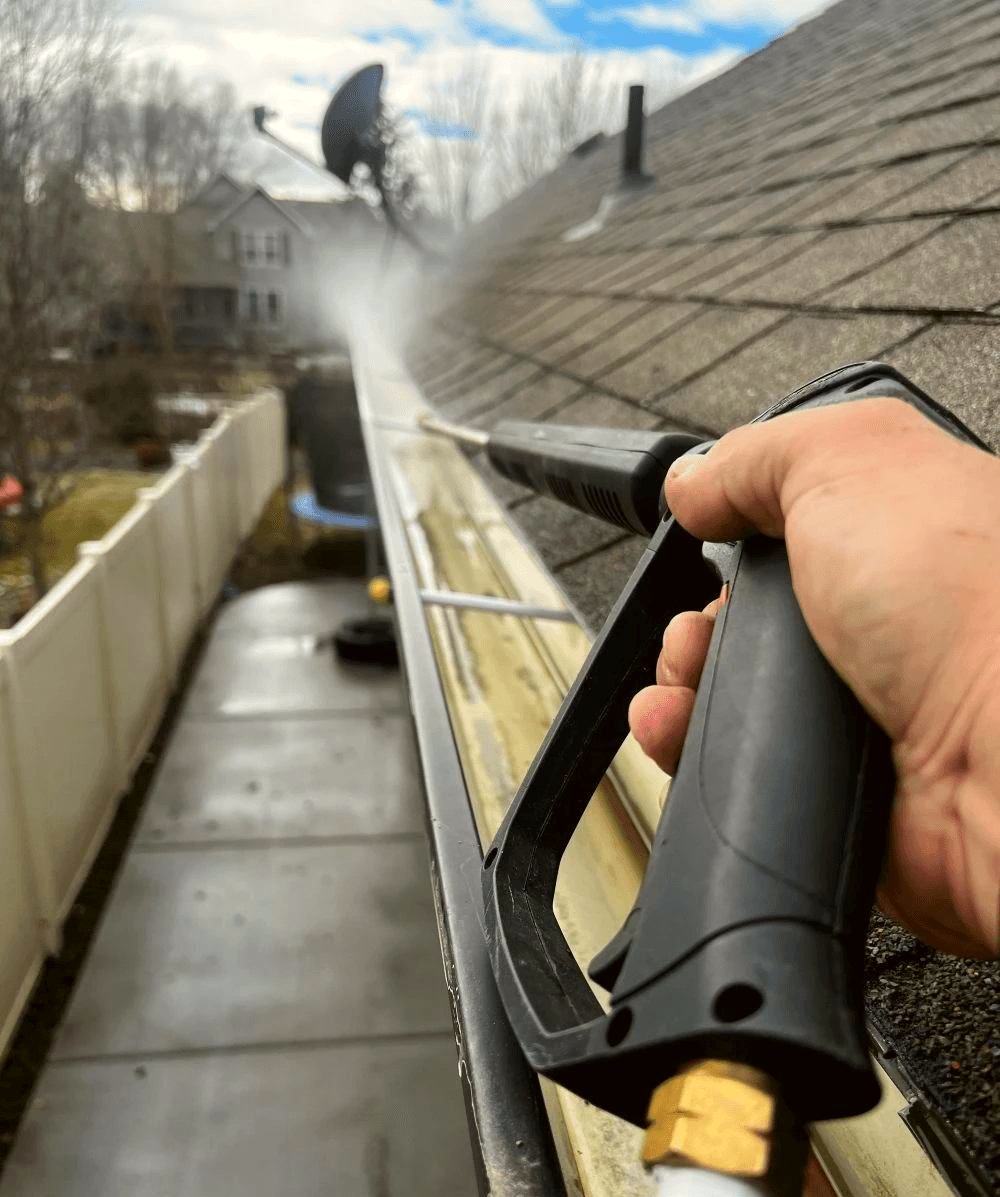 Gutter cleaning with a pressure washer