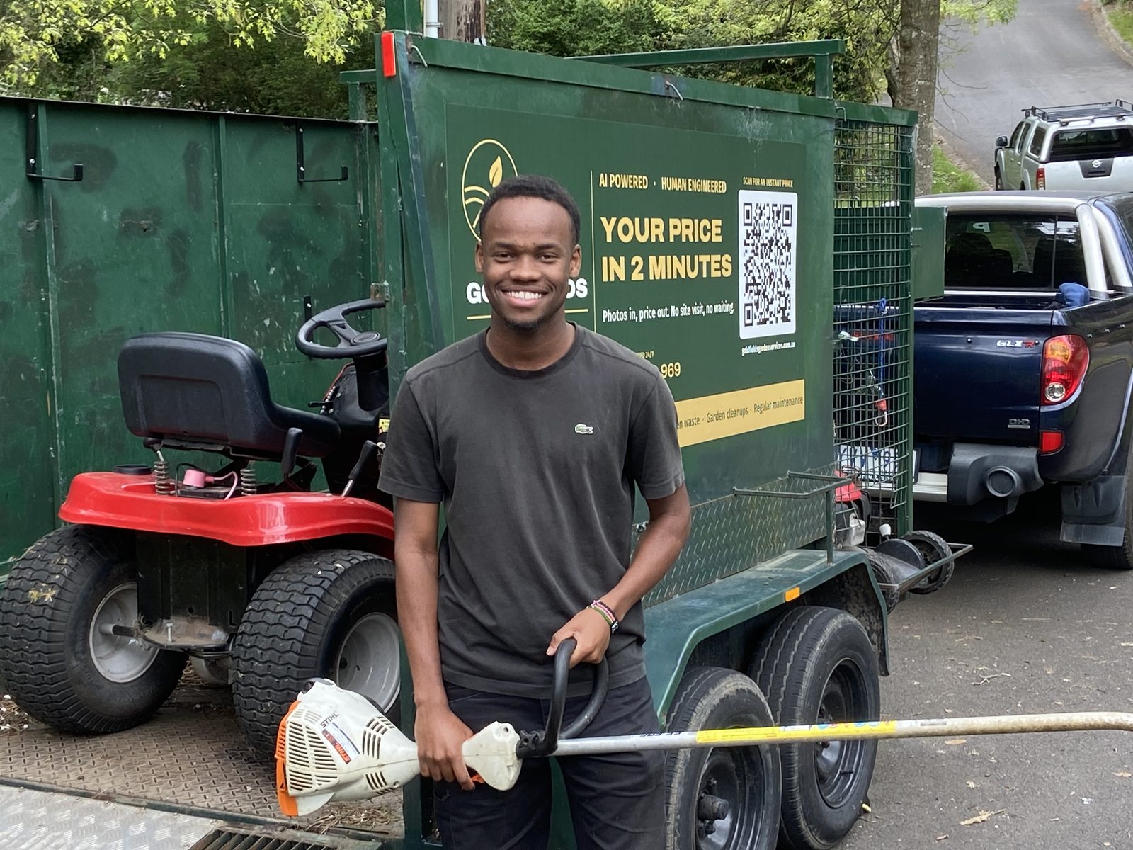 Allan with the whipper snipper in front of the Goldfields trailer